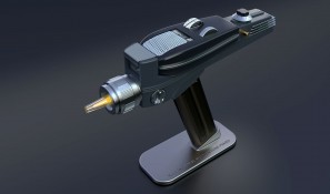 Phaser displayed on magnetic stand with tip glowing yellow