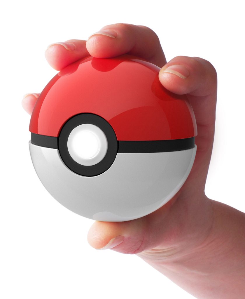 hand holding Poké Ball