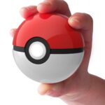 hand holding Poké Ball